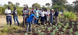 Villagers of Kibiri ward at Caleb's farm